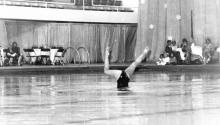 A woman's legs stick out of a swimming pool