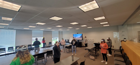 Students using virtual reality headsets in a class