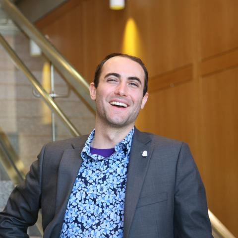 Billy Tringali Standing on the steps of the university library